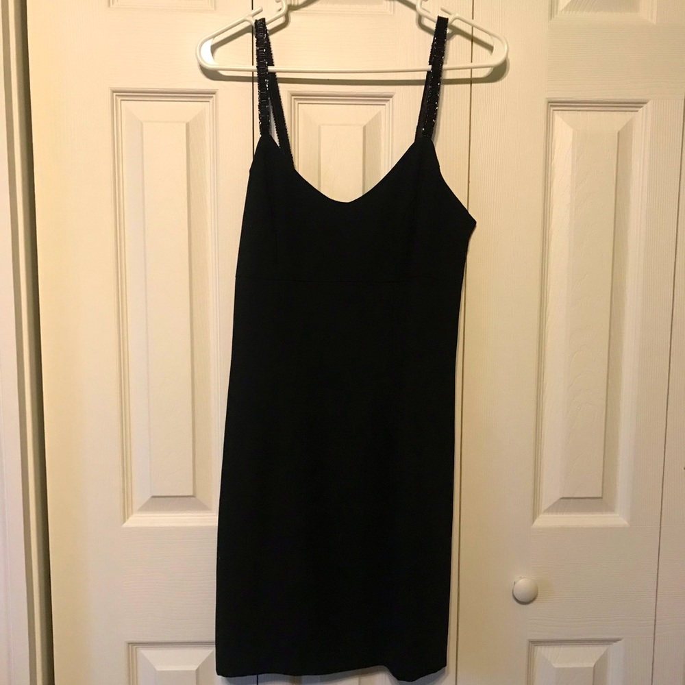 The little black dress, somewhat vintage, has beaded straps. Very pretty fit